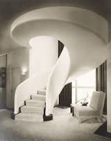 A swirling, sculptural staircase serves as the centerpiece in this 1940 residence designed by Samuel A. Marx for Morton D. May in Ladue, Missouri. 

Credit: © Chicago History Museum, Hedrich-Blessing, photographer