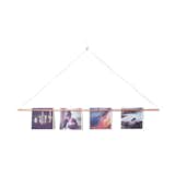 Last but not least, this Copper Photo Bar Picture Hanger uses a single nail to hold photos, print, or any graphic material. Designed by Yield Design Co. and Social Print Studio, it can be hung anywhere and - thanks to its six magnets - it won't harm your artwork.