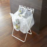 From Japanese company Yamazaki, the Recycling Bag Stand is an innovative accessory designed with urban living in mind. The simple accessory unfolds to a standing position that can hold several plastic bags—from grocery shopping, takeout, and other errands—enabling users to directly recycle plastic containers, cans, and other items into the bags.  Photo 1 of 9 in Living space by Louis David Perez from Dwell Store Editor’s Picks: Shop the Special Issue