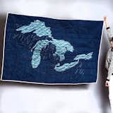 Another beautiful design from Haptic Lab and by Emily Fischer, the Great Lakes Quilt features light blue, poly-silk, hand-appliqued shapes against a navy background.