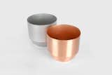 Spun Planter by Yield Design, $110 from yielddesign.co

Made in the USA from a single piece of copper, this handy planter features a reservoir that separates standing water from a plant's roots.  Search “galvanized-planters.html”