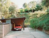 Garage The carport leads to the entrance.  Photo 3 of 15 in L.A. Renovation Respects Midcentury Bones (While Adding Some Flair)