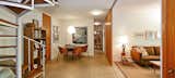 A lower floor hides underneath and contains three bedrooms, two full baths, storage area, workshop, storage area, and a den with sliding walls.