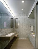 Wrapped in Anne Sacks tile, the master bathroom is outfitted with fixtures by Kohler.