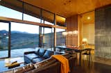 A Maxwell sofa from Restoration Hardware is the best seat in the house to watch the amazing sunsets.  Photo 6 of 8 in A Weathering Steel Retreat in the Foothills of the Cascades by Caroline Wallis