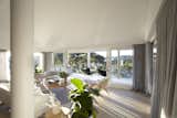 The veranda wraps around the northern and eastern sides of the home, capturing the movement of the sun across the sky.