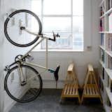 The Cycloc Endo Hanging Bike Rack can store bicyles on the wall or floor: one piece locks the front tire in place with the other secures the back tire. Wide rubber contact points prevent scuffing and the locking mechanism accommodates a wide range of tires; the rack comes in a black, green, or white version.
