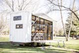 Unpacking the deck and awning reveals a glass wall that opens the trailer to its environment, wherever that may be. The ATLAS can be hitched to a truck to travel easily from campsite to campsite.