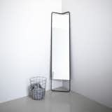 A subtle, triangular shape on the upper end of its frame makes this lean, full-body floor mirror by KaschKasch for Menu apt for small spaces. Lean it against a wall or nestle it in a corner—no installation required.