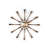 A work of American design icon George Nelson, the Nelson Spindle Clock sports twelve turned walnut spindles, accented with luxe brass, that mark the time.