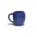 Recalling Bauer's classic 1930s styling, the Bauer Pottery 12 oz. Beehive Coffee Mug sports undulating curves create a unique tactile experience. It's currently available in navy blue (seen here) and white.