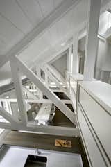 The second-story, basically a catwalk that threads between the large, exposed trusses, is mostly residual space used for storage.