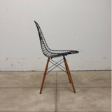 One of Aldana's Eames wire chairs.