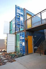Exterior, Metal Roof Material, Apartment Building Type, Shipping Container Building Type, Metal Siding Material, and Flat RoofLine Floor-to-ceiling windows front each unit, with sections of container wall folded out and fixed in place as part of the shading strategy.  Photo 3 of 8 in New Shipping Container Apartments Bring Market-Rate Rent to Downtown Phoenix