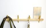 A graduate of the Industrial Design Program at the University of Cincinnati, John Dixon of Dixon Branded has a knack for making simple but refined objects. His Intersect Series wall hooks pair ash with brass.