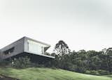 Grass, Exterior, House, Concrete, Glass, and Flat Teeland Architects designed this modern home on Australia’s Sunshine Coast in order to maximize views of the Pacific Ocean to the east as well as the surrounding forest to the north.  Exterior House Grass Glass Concrete Photos from Modern House Captures Panoramic Views in Australia