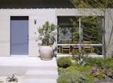 “The original home was in a state of disrepair, had a series of dark, small rooms that were disjointed, and it had very little connection to the outdoors,” Montalba said. The exterior’s wood siding was replaced with concrete board, and native plants grow in the front and backyards.  Photo 1 of 8 in A California Ranch Renovation Opens to the Outdoors by Kelly Dawson