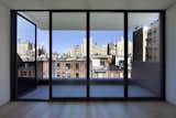 The fifth story was added late in the design process because “our clients wanted to have their own private space,” Ruggieri says. The stunning north view across Manhattan from the penthouse is one of the home’s best features, outlined in black steel windows by Optimum.
