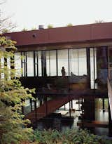Exterior, Flat RoofLine, Glass Siding Material, House Building Type, and Wood Siding Material “We wanted the exterior to be the artwork,” Ryan says.  Search “green-roof” from Glass House with Stunning Pacific Ocean Views