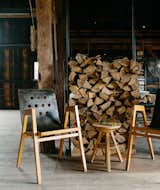 Living Room, Chair, and Light Hardwood Floor Vintage bent plywood stacking chairs by Roland Rainer are purposeful and can be moved to suit any situation.  Search “laundryappliances--stacked” from A Passive House and “Sauna Tower” Join a 19th-Century Barn in the Hudson Valley