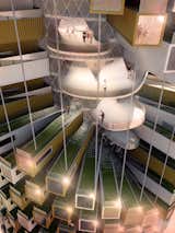 The tower will be built around a large circulatory ramp rather than stairs. The design is meant to limit obstacles that might hinder spontaneous interactions.