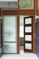 The home’s front door, by Simpson Door Company, fills an eight-foot frame with sapele veneer on solid wood. “Sapele [is] an African mahogany often used in marine construction,” Witt says. An Emtek Hera handle is fastened to the door.