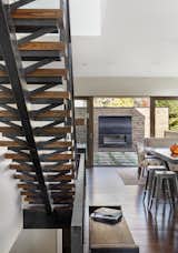 Mitchell wanted to detail the solid oak staircase with that same sense of openness, even though its materials are heavy. “We used a lot of raw steel and wood on the interior of the home,” Mitchell said. “This carries the authenticity of real materials from the building exterior to the building interior.” A custom fireplace sits on the patio.