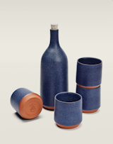 Serving set by Mazama Wares, $210

The midnight-blue speckle of this hand-thrown ceramic bottle and quartet of tumblers is a celestial sight to behold. Also available in ash (black), glass (green), and cloud (gray).  Photo 10 of 38 in Favorites by ITAL/C from Modern Products, All Made in the USA
