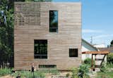 A basic box that’s as tall as it is wide (28 feet) and 16 feet long, this Portland, Oregon house consists of rooms stacked vertically: an unfinished basement on the bottom, a kitchen-living area and a bathroom in the middle, and a bedroom on top, with the stairwell hinged onto the front of the home. The only interior doors are those to the bathroom, basement, and root cellar, leaving the rest of the space open and unfettered. At just 704 square feet, Katherine Bovee and Matt Kirkpatrick's home is a great lesson in making the most out of every inch.
