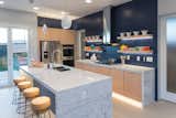 After outdoor living, an open-plan kitchen was the second highest requirement that Millennials listed in the survey. Appliances from the Whirlpool Corporation outfit the multifunctional room.