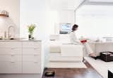 At her New York apartment, architect and interior designer Page Goolrick made sliding partitions that when closed still allow light to flow through her 560-square-foot space, and when opened reveal cocoonlike sleeping quarters.
