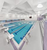 Macrae-Gibson designed this competition swimming pool for Truman High School in the Bronx. The space features glazed acoustic concrete block walls and a ceramic mosaic pool and deck.  Search “bronx” from Building Modern Schools in New York City