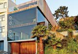 For a San Francisco couple living on a hill overlooking the Mission District in San Francisco, glass walls were a must. Indoor louvers allow the residents to frame their view of the city, much like the aperture on a camera.
