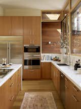 In addition to Wolf and Sub-Zero appliances, the kitchen features an on-demand hot water recirculation pump that reduces wasteful water heating. Schwinn cabinet pulls adorn the custom cabinetry and the K7 faucet is from Grohe.