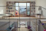 Mesh is strung along the stairs and railings as a safety precaution for the couple’s first child, who was born during construction. The material also serves as a screen for filtering the light.  Photo 4 of 7 in A 16-Foot-Wide Barcelona Row House Gets Creative to Stay Bright and Airy by Alex Vuocolo