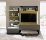 A freestanding Smart Living media unit conceals a complete dining set for six behind the television.