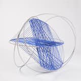DSH Architecture used five aluminum Hula Hoops, woven with a spiral cat's cradle of rayon webbing, to create a playful perch for cats.  Photo 3 of 4 in Cat Stuff by William Alan Simmons
