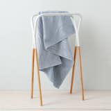 Modern Two-Tone towel rack by West Elm, $49 A perky rack with a straightforward purpose and a price to match. The wood can help add a warm touch to a cold bathroom.  Search “lana-towel.html” from Editors' Essentials: Garment Racks