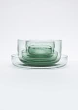 A glassware collection by Nendo made from recycled Coca-Cola bottles.