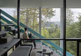 A south-facing wall of windows allows for spectacular views and maximizes passive solar heating.  Photo 6 of 6 in Unique Ways to Frame a View by Zach Edelson from Dozens of Levels Give a Quebec Home Stadium-Sized Views of the Forest