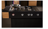 The cook station is outfitted with a Teppan Yaki grill alongside a normal two-ring gas hob unit and a wok gas unit. The concept team, which includes designers Mario Zeppetzauer, Stefan Radinger, and Stefan Degn, chef Harald Hochettlinger, and master carpenter Gerhard Spitzbart, are careful to point out that they specified gas because “we wanted quality” but with this caveat: "Above all in terms of energy efficiency we see the induction hob as a comparable alternative.”  Photo 6 of 6 in A Concept Kitchen Just for Vegetarians by Amanda Dameron