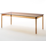 Transparent extralight glass is printed with a wood grain-like effect to achieve this contemporary take on the dining table table by artist and designer Ron Gilad.