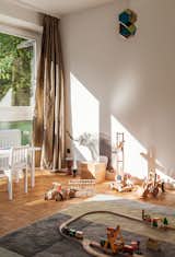 The feel of natural materials on the skin can make a home comforting. A Colour Carpet by Scholten & Baijings for HAY, made with 100% New Zealand wool, defines the play area in the child’s bedroom of this house in Hamburg, Germany.