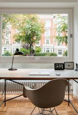 Office, Study Room Type, Chair, and Desk A small office for Dorothee, furnished with a desk by German architect Egon Eiermann and an Eames chair, overlooks the street.  Search “eames aluminum group management chair” from We Can’t Get Enough of This German Apartment’s Sleek Matte-Black Kitchen