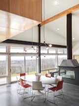 “The windows and patio doors, all made from super low-E insulated glass, open onto the amazing views and give easy access to expansive decks and a pool terrace,” Mulvena says. His team conducted solar studies and installed a retractable screen from MechoShade that would shade the house in the summer.