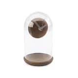 Created by Umbra, the walnut Suspend Clock mysteriously floats in a glass casing, leaving spectators bewildered.