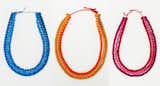 Chi-Chi 3-strand yarn necklace by Grain in blue, orange, and pink. The necklace is named for the famous Chichicastenango Market, known by many as the most colorful market in North America. $38 each at AmDC.