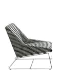 Designed by Mârten Claesson for Swedese, the Gran Turismo Easy Chair features a houndstooth-like pattern over a solid wood and steel frame.
