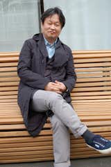 Naoto Fukasawa takes his turn posing on his Titikaka bench, which features undulating teak slats and an aluminum frame. In conversation with Sam Grawe, the designer said the sinuous form, as well as the name, was inspired by the traditional straw boats of Peru and Bolivia.