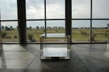 The aluminum pieces are the center of Judd's collection. It took four years to install them all to Judd's famously exacting standards. Judd's poured-concrete structures are in the distance, situated next to a scrim of cottonwoods that Judd planted to form a perimeter to the site.